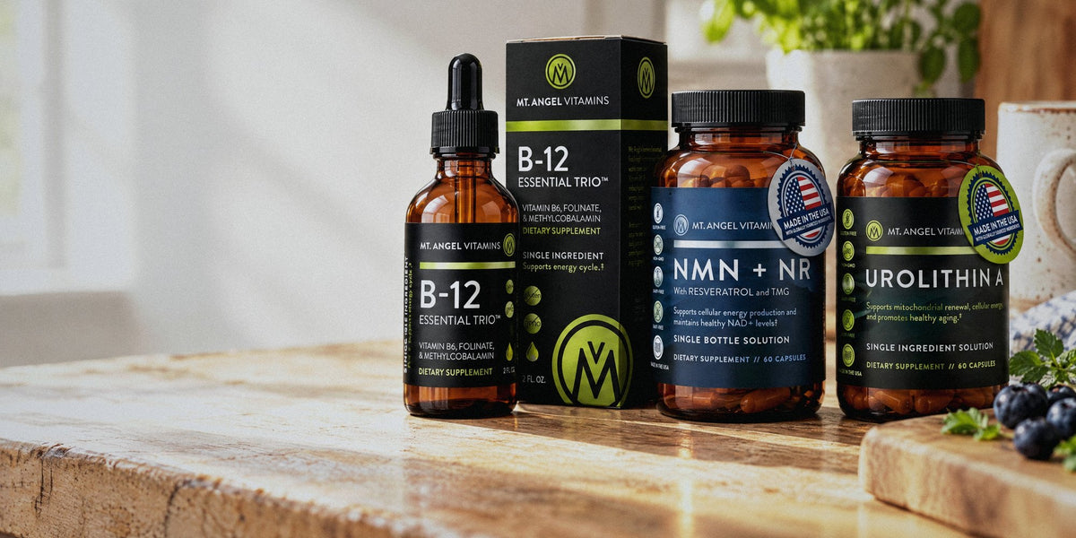 Mt. Angel Vitamins B-12 Essential Trio, NMN + NR and Urolithin A on a sunlit kitchen counter