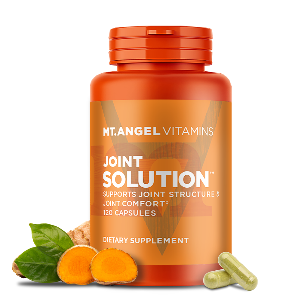Image of Mt. Angel Vitamins' Joint Solution on a white background, next to turmeric root and two capsules. joint health joint support inflammation response swelling joint vitamin move free joint supplement